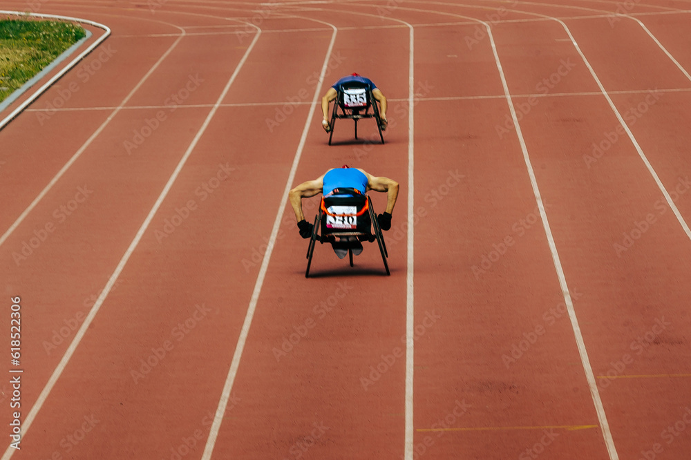 two athletes in wheelchair racing race track stadium in para athletics championship, summer sports g