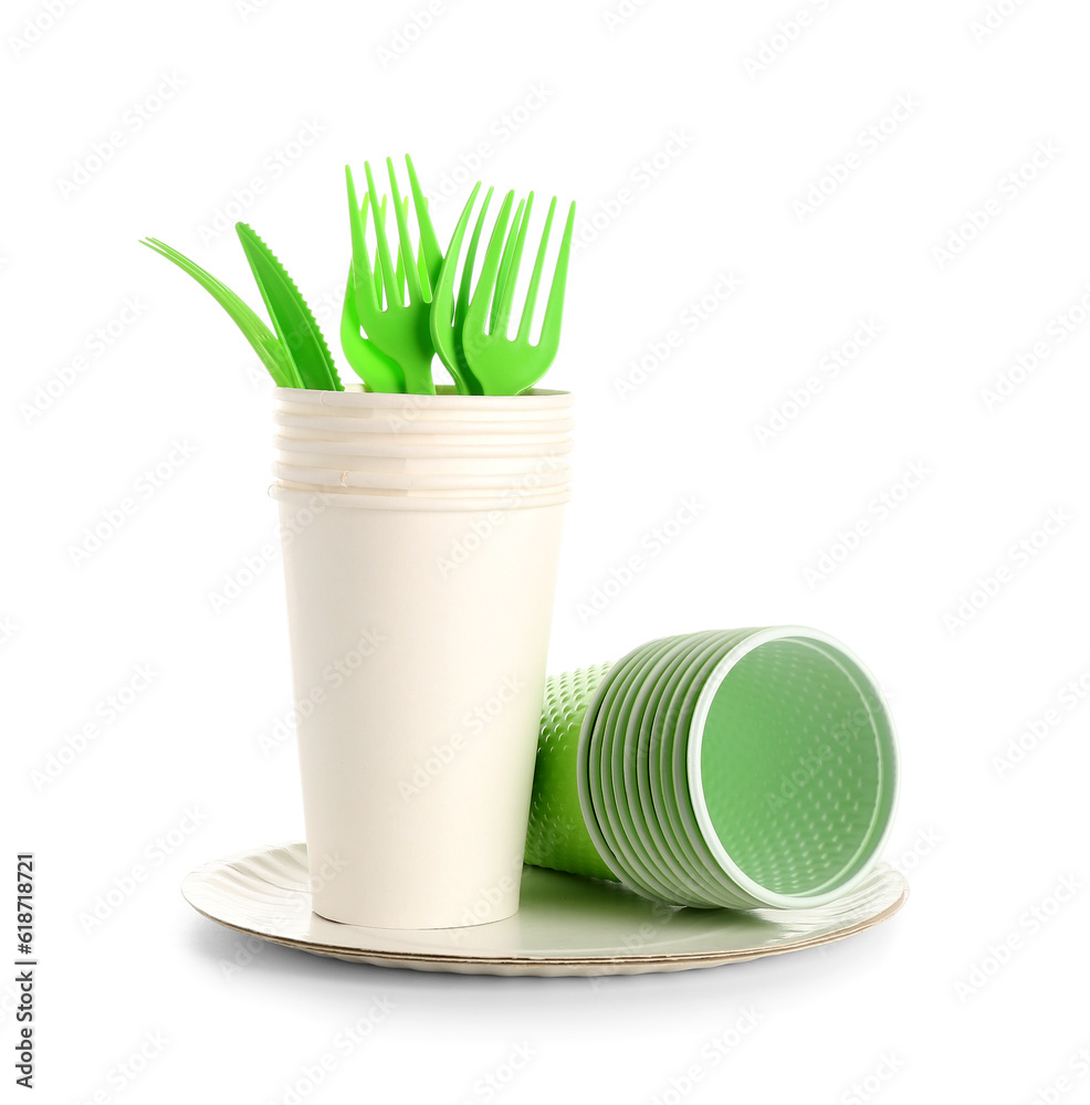 Plastic and paper tableware for picnic on white background