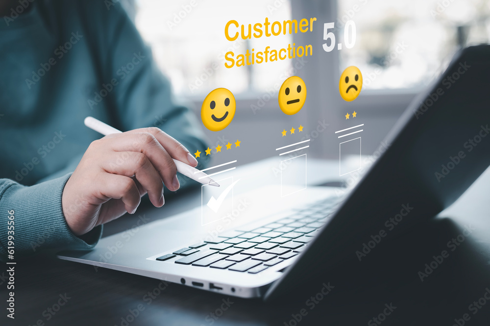 Businessman pressing smile on laptop keyboard customer service, evaluation concept , rating to servi
