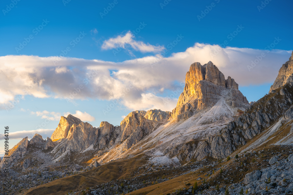 Dolomite Alps, Italy. View of the mountains and high cliffs during sunset. High sharp rocks and soft