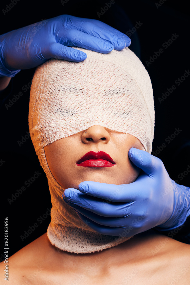 Plastic surgery, cosmetics and bandage on face of woman in studio for beauty, skincare and dermatolo