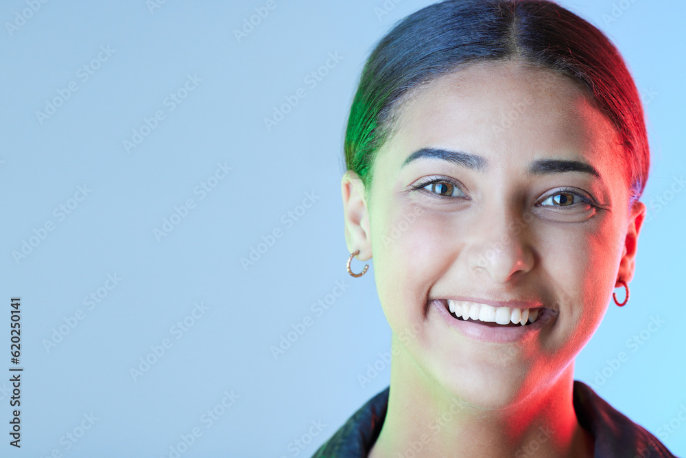 Portrait, smile and mockup with a woman on a blue background in studio for a logo or branding. Happy