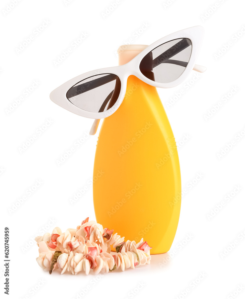 Creative composition with seashells necklace, sunglasses and bottle of sunscreen cream isolated on w