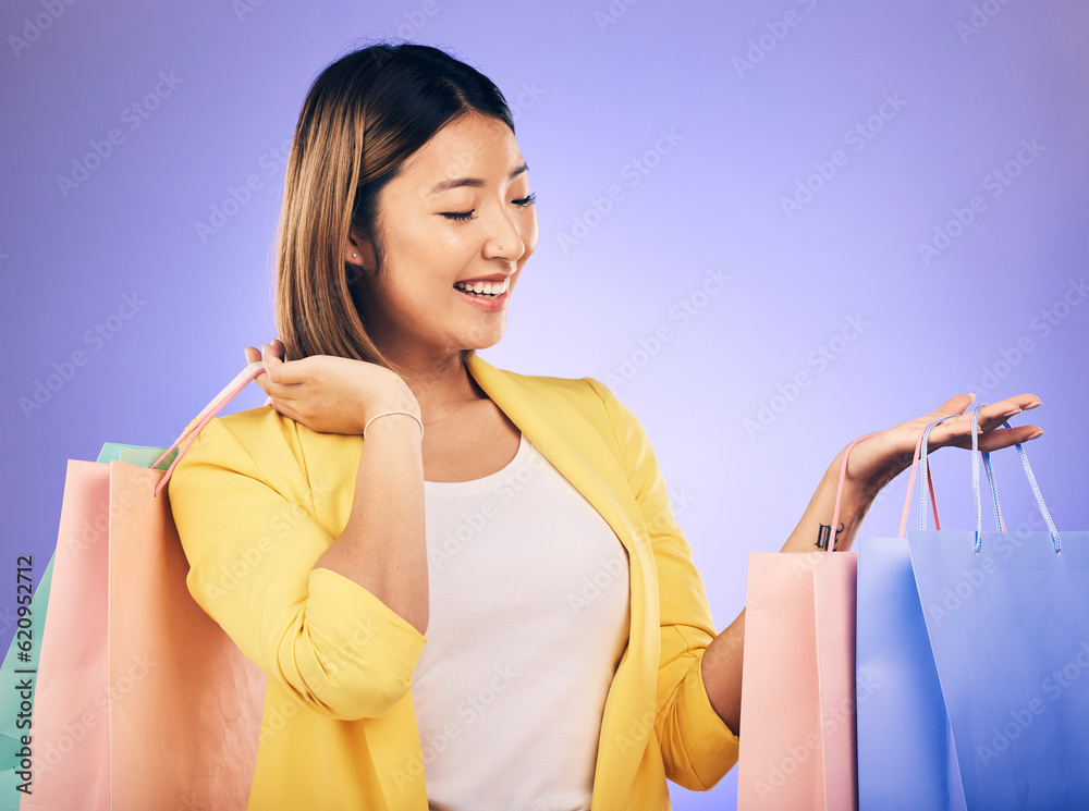 Happy, face and woman with shopping bag from a sale, promotion or customer with deal on retail cloth