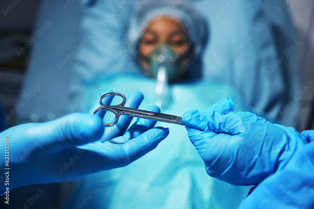 Hands, scissors for operation and a surgeon team with a patient in the hospital emergency room. Medi