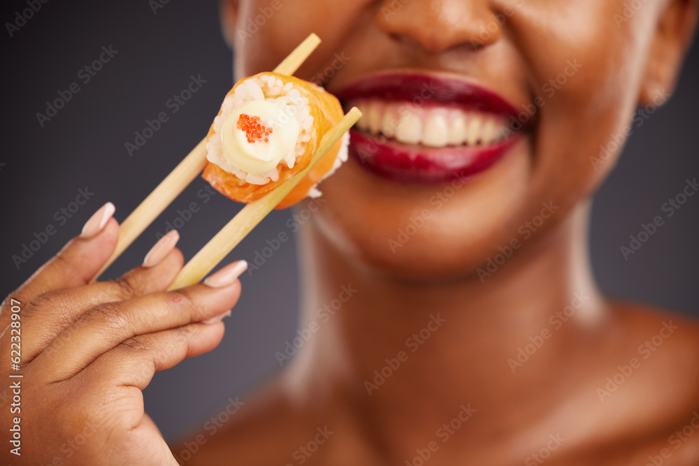 Sushi, chopsticks and mouth of a woman in studio for healthy eating, salmon or food. Black female mo