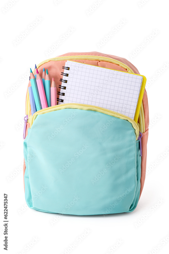 Backpack with blank notebook and different stationery isolated on white background