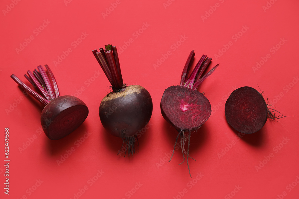 Fresh beets on red background