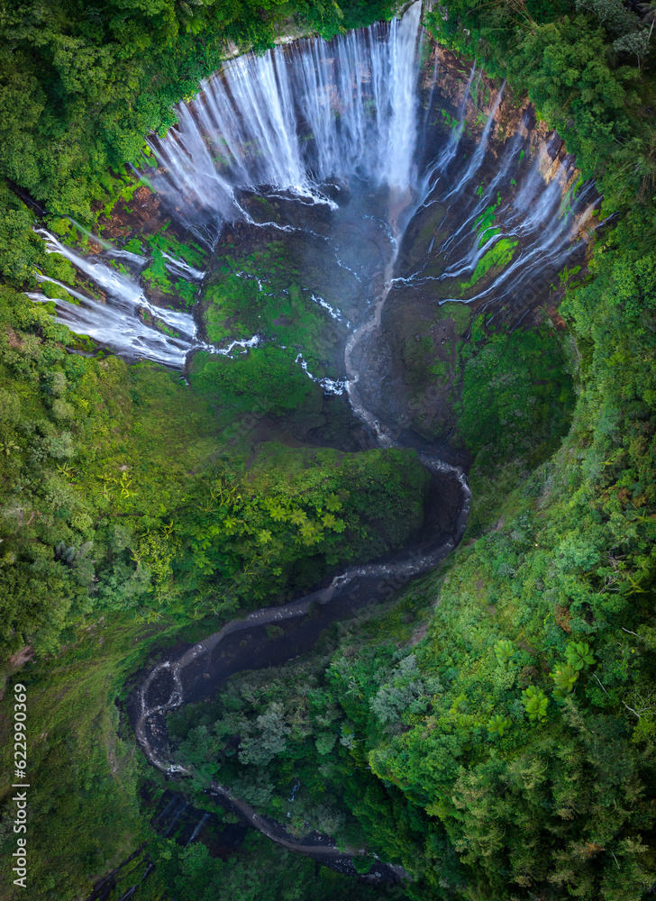 Aerial top view from above of Tumpak Sewu ,also known as Coban Sewu, 120m high waterfall in Malang r