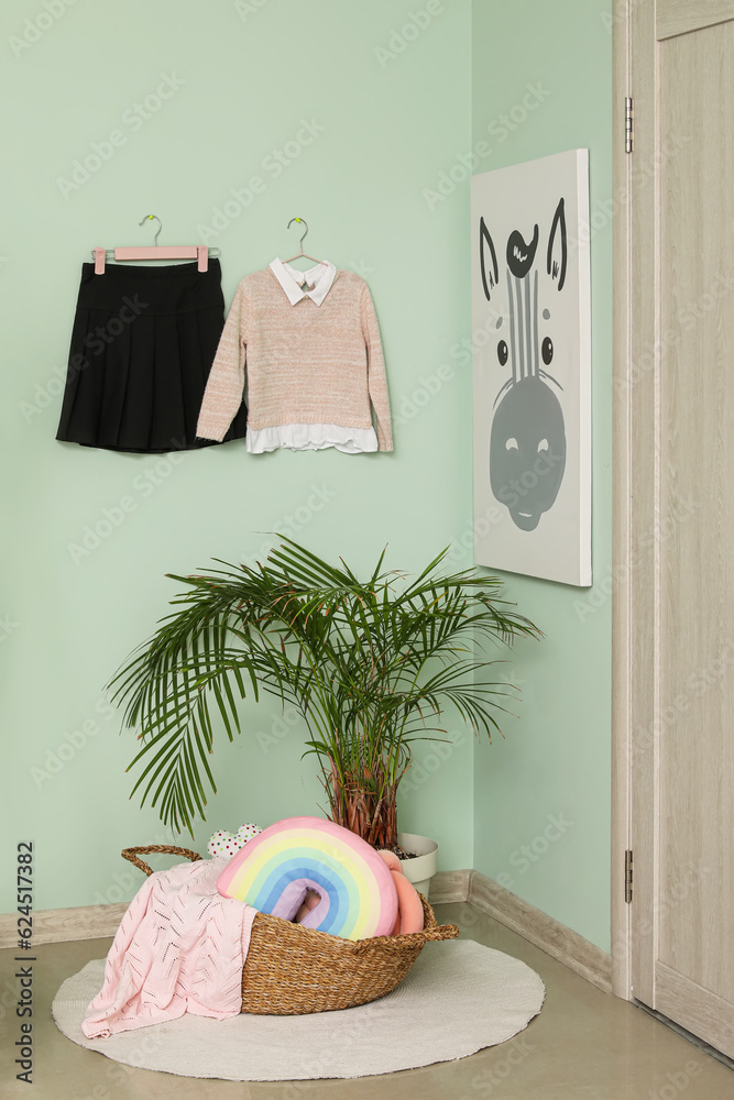 Stylish school uniform and houseplant in childrens room