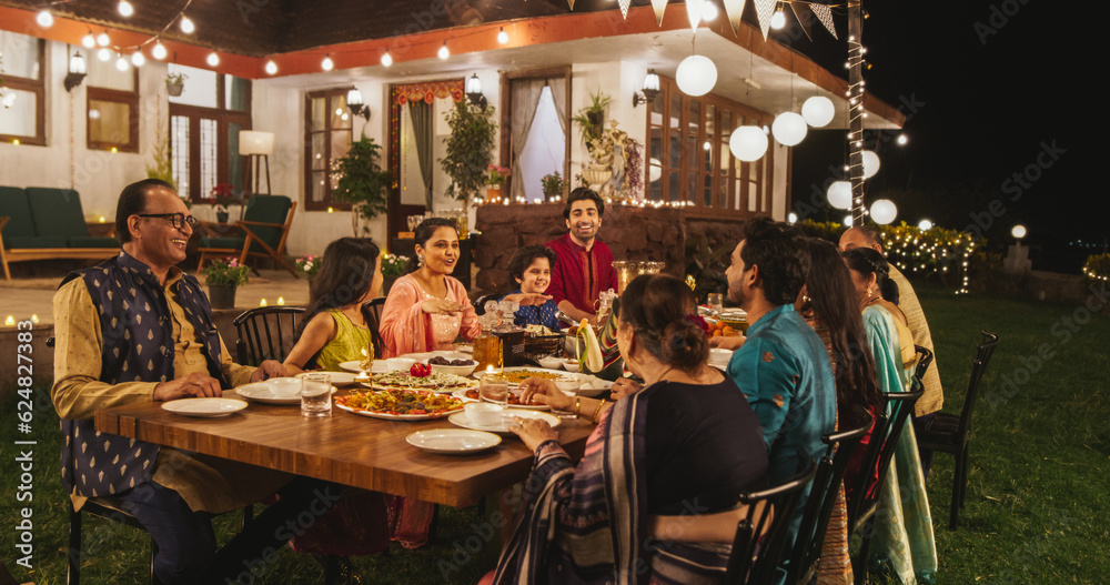 Big Indian Family Celebrating Diwali: Family Gathered Together on a Dinner Table in a Backyard Garde