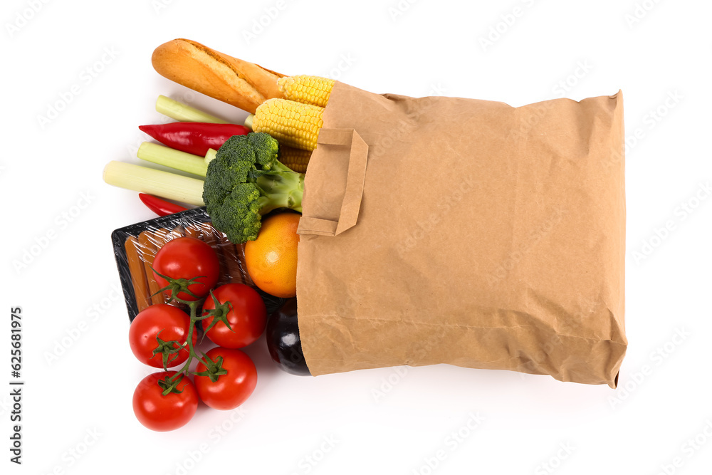 Paper bag with different products on white background. Grocery shopping concept