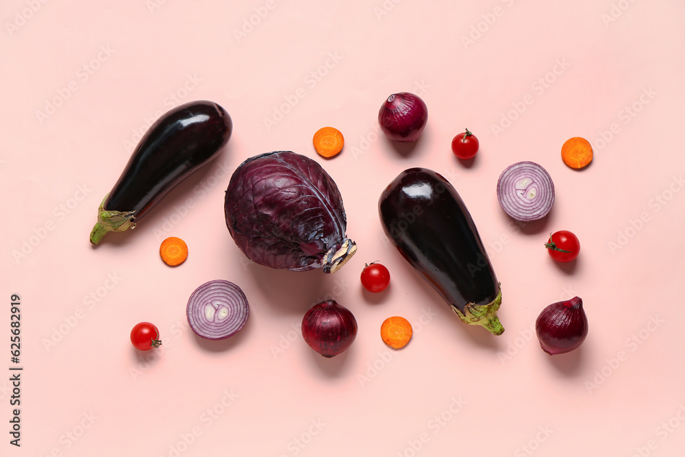 Fresh eggplants with cabbage and onions on beige background. Healthy food concept