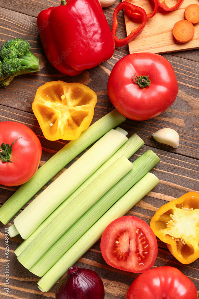 Different fresh vegetables on wooden background