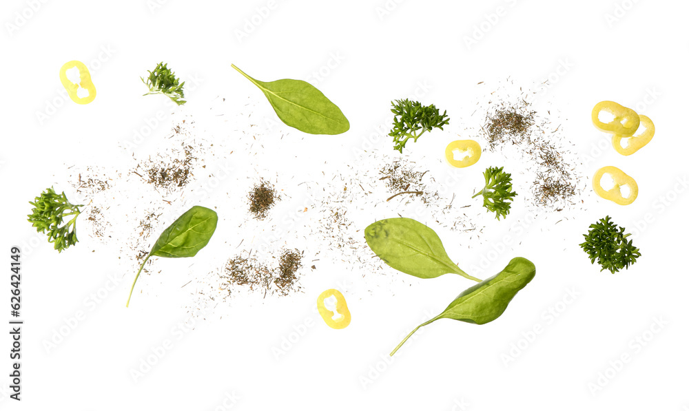 Flying herbs, chili pepper and spices on white background