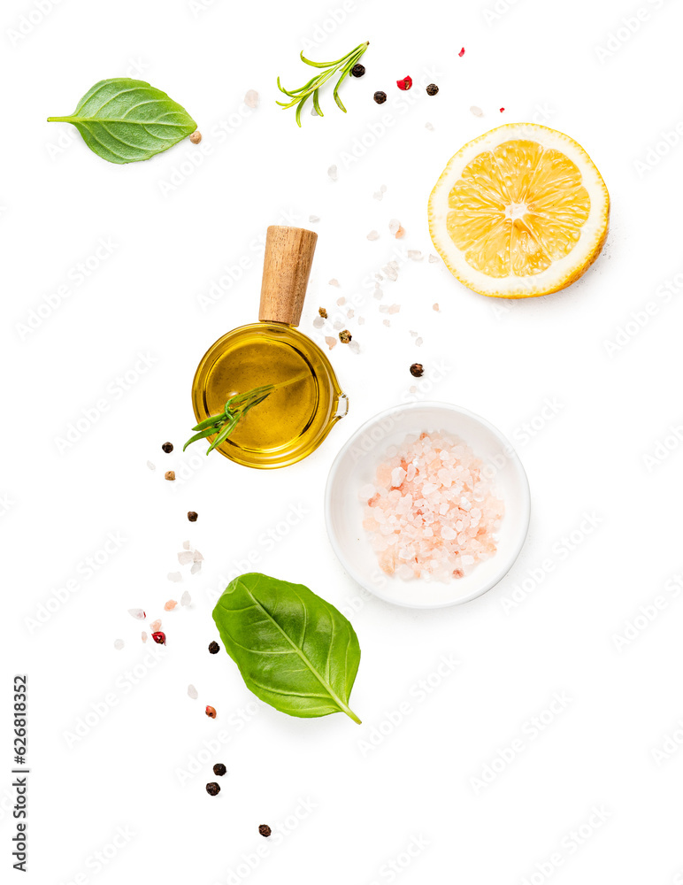 Various herbs and spices, oil in white bowl and half of lemon isolated.