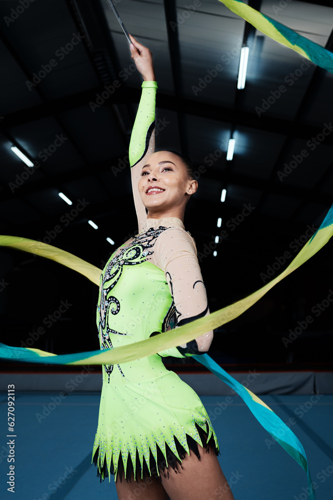 Happy, woman and rhythmic gymnastics with ribbon in gym, creativity and action, performance and fitn