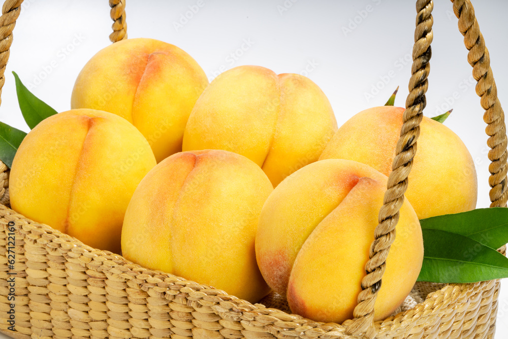 Yellow Peach with sliced on white Background, Fresh peach in wooden basket on white Background.