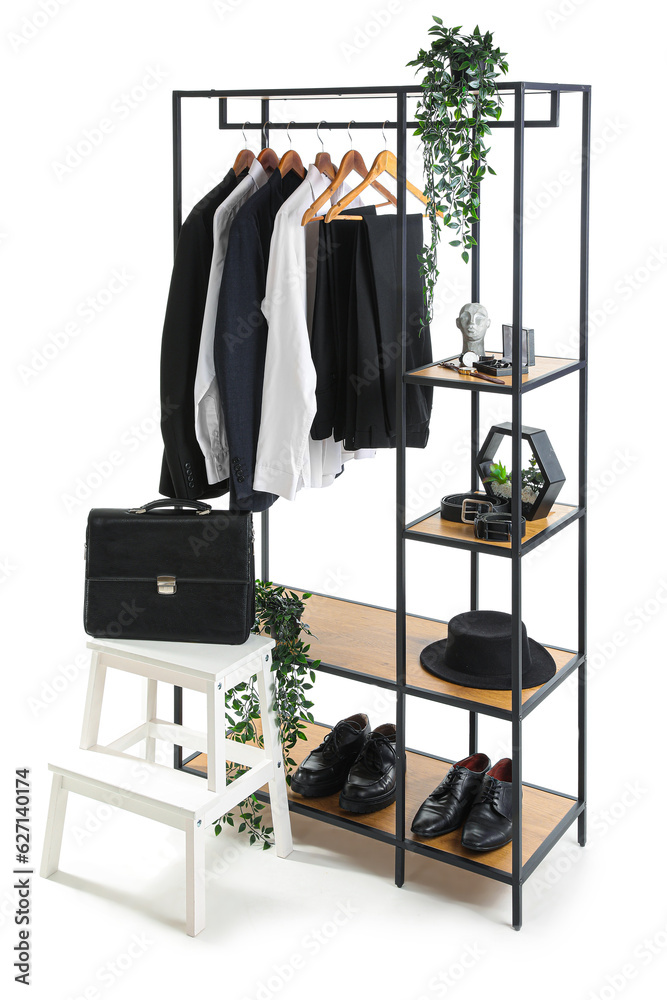 Shelving unit with clothes, shoes and accessories on white background