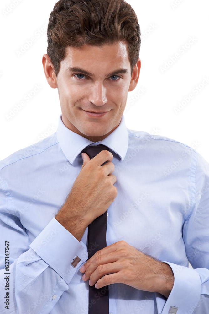 Dressed for success. A handsome young businessman adjusting his tie.
