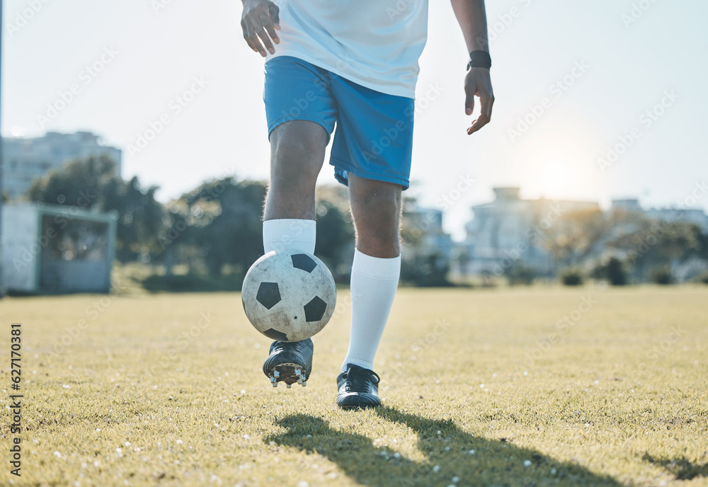 Training, field and legs of a man with a football for a game, fitness and learning sports. Grass, wo