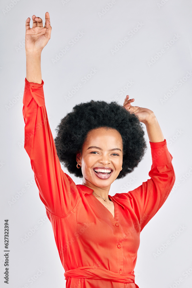 Happy black woman, portrait and dancing with afro in stylish fashion against a white studio backgrou