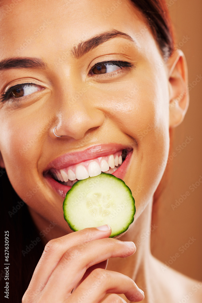Thinking, cucumber and woman with skincare, natural beauty and cosmetics on a brown studio backgroun