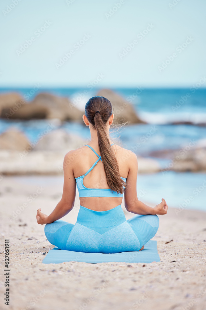 Meditation, fitness and back view of woman at the beach for workout or training as health, mindfulne