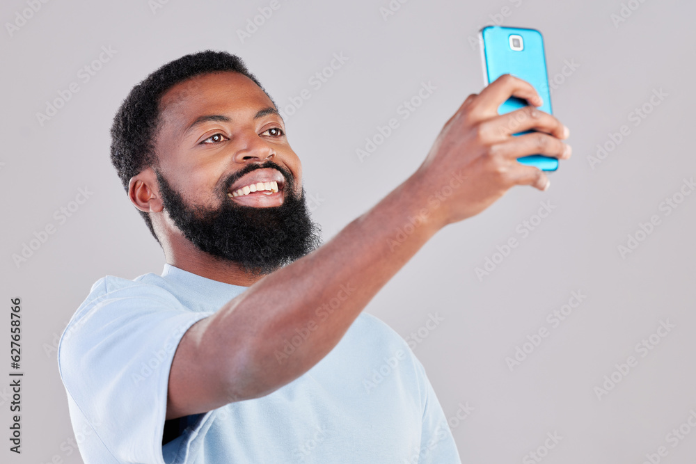 Happy black man, selfie and photography for social media, vlog or networking against a grey studio b