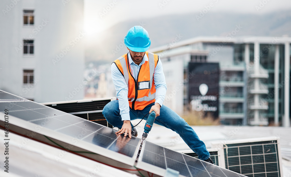 Technician man, drill and solar panel on roof with installation, sustainability and construction in 