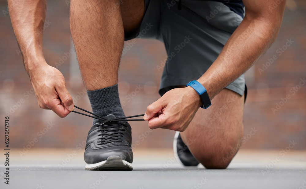Person hands, sports and tie shoes for running workout, training and action performance on ground ou