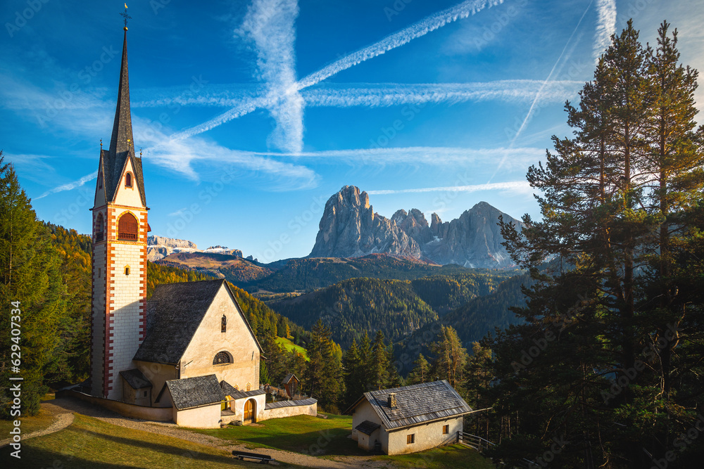 St Jakob church in the autumn forest, Dolomites, Italy