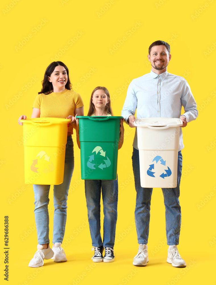 Family with recycle bins on yellow background