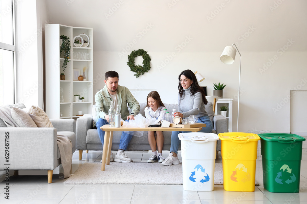 Family sorting garbage at home