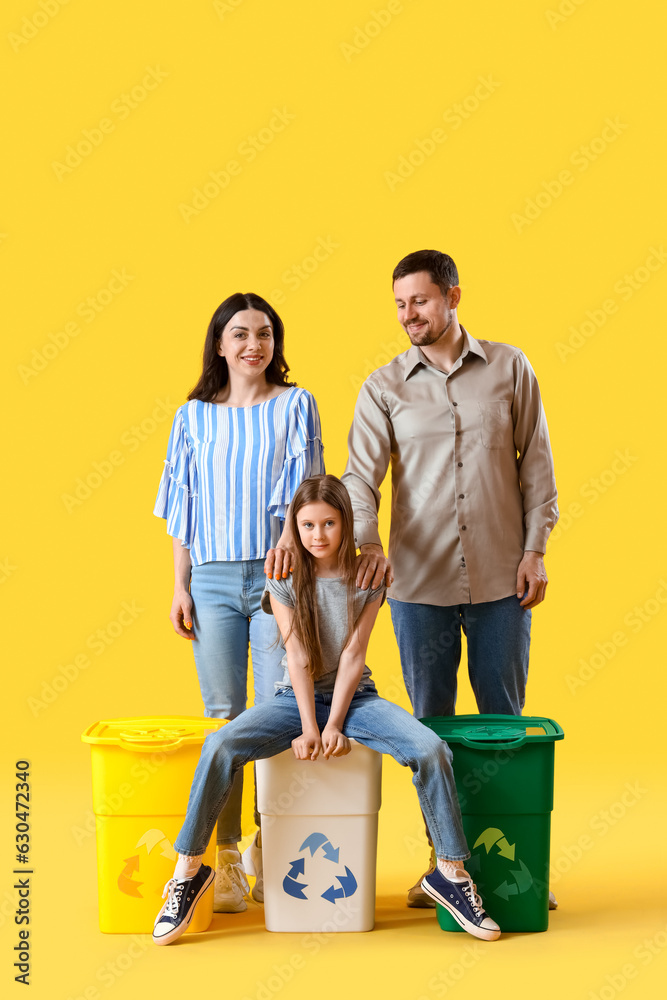 Family with recycle bins on yellow background