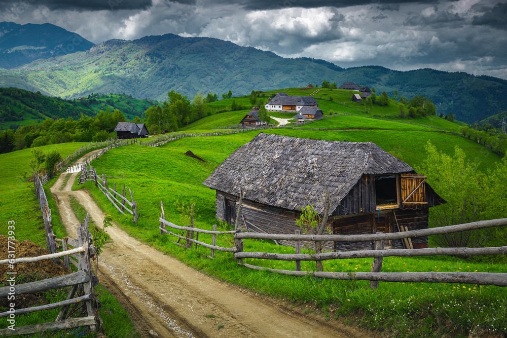 Great rural landscape with gardens and wooden barns, Transylvania, Romania