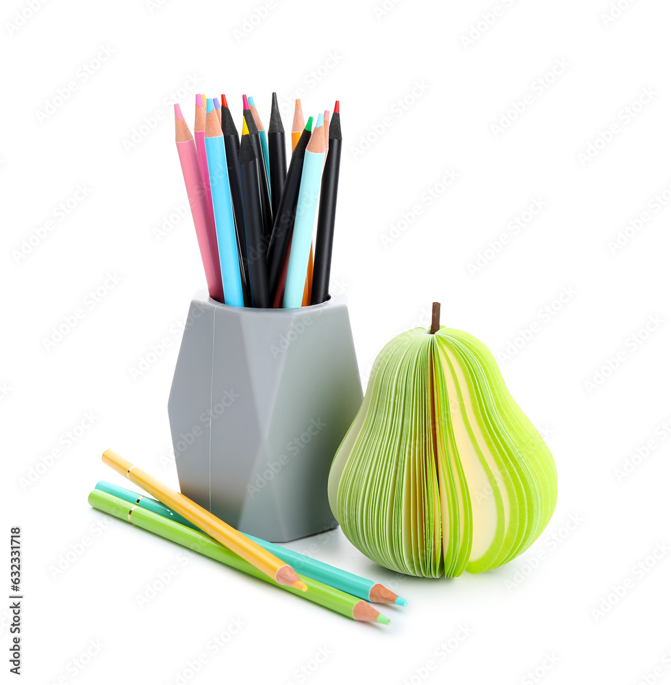 Holder with different color pencils and sticky notes on white background