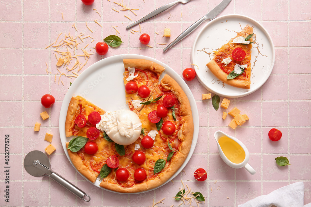 Plates of tasty pizza with Burrata cheese on pink tile background