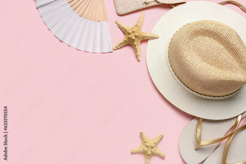 Composition with beach accessories and starfishes on pink background