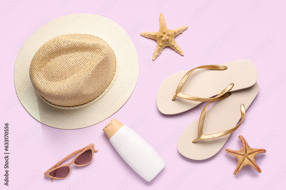 Composition with beach accessories and bottle of sunscreen cream on color background