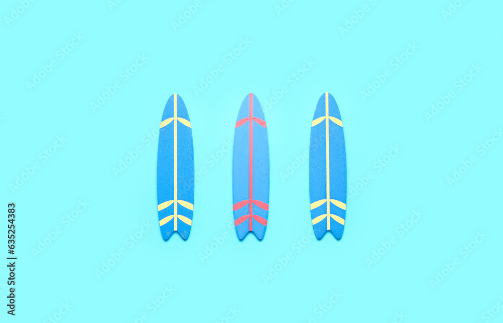 Mini surfboards on blue background