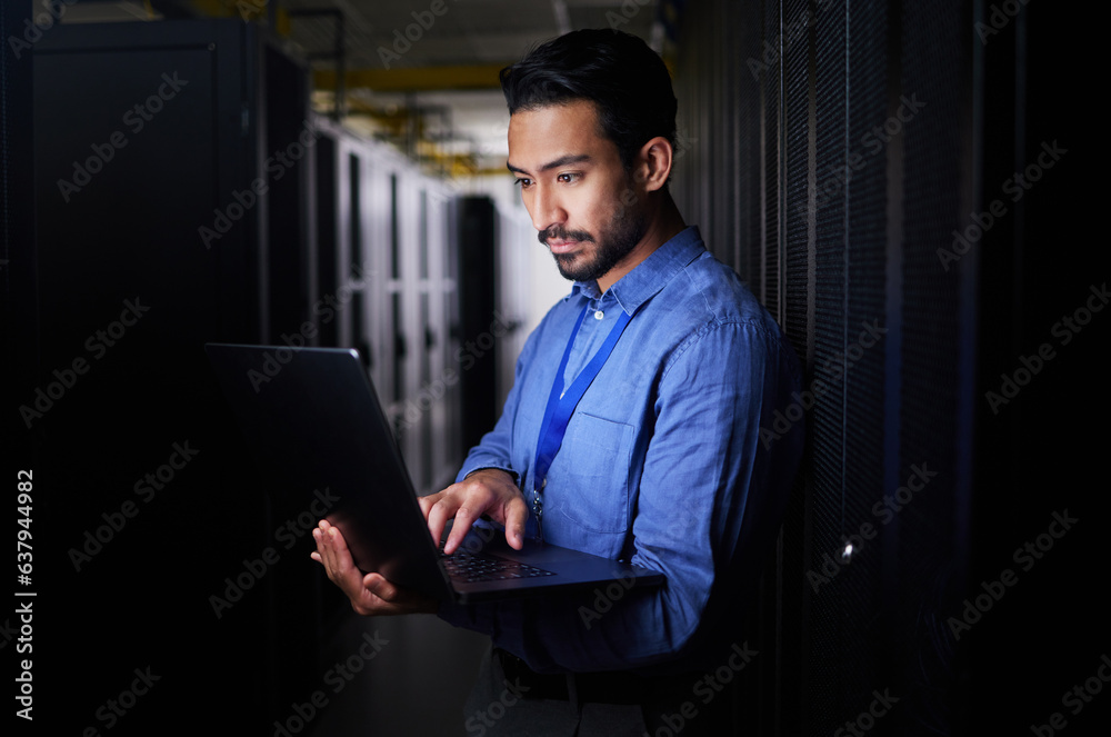 Man, server room and laptop of programming, system management and data center solution or coding at 