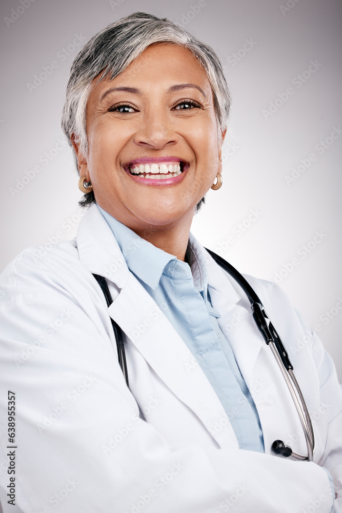 Woman, portrait and doctor with arms crossed in studio for healthcare services, smile and consulting