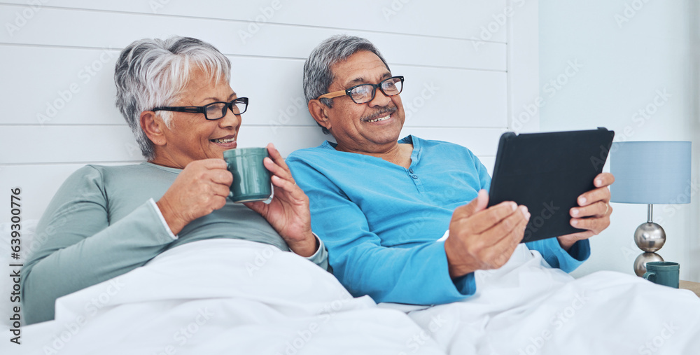 Tablet, mature couple and coffee in bed at home together on social media, streaming movie and film i