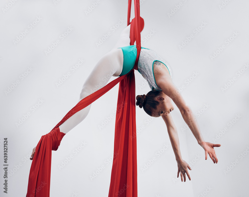 Aerial, woman gymnast and fitness performance with stretching, flexibility and athlete with white ba