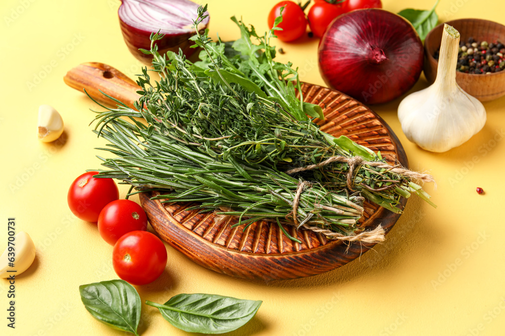 Composition with fresh herbs, vegetables and spices on color background