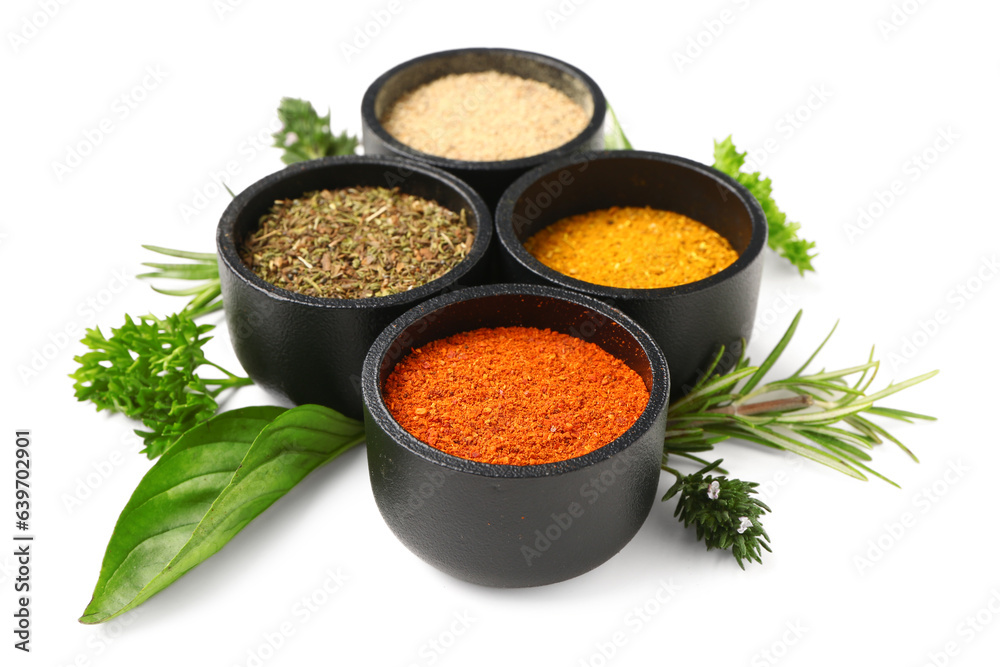 Composition with bowls of fresh spices and herbs isolated on white background