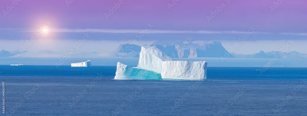 Iceberg seen from cruise ship vacation near Greenland coast in Arctic circle near Ilulissat Disko Ba