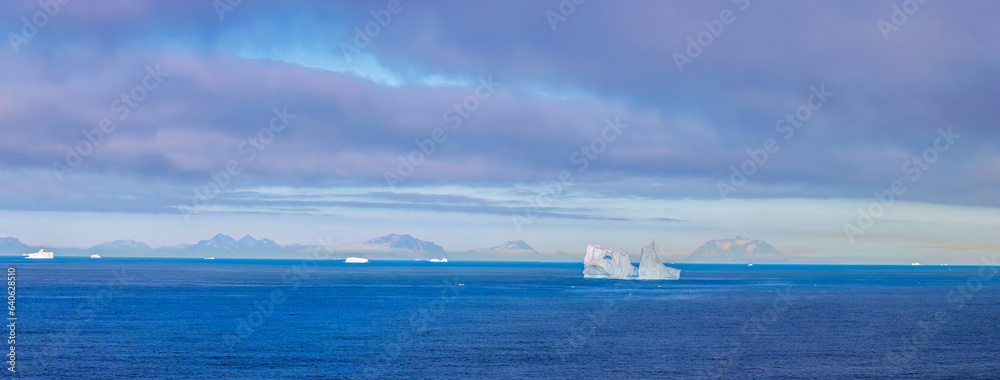 Iceberg seen from cruise ship vacation near Greenland coast in Arctic circle near Ilulissat Disko Ba