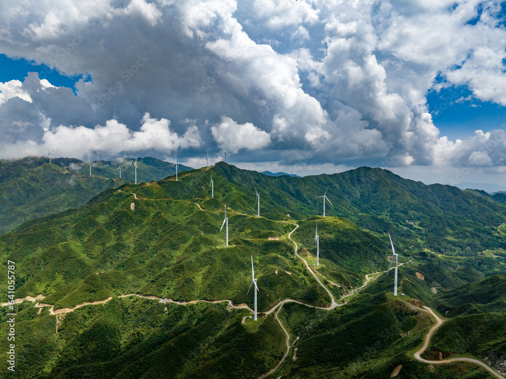 Wind power on the mountain, blue sky and white clouds